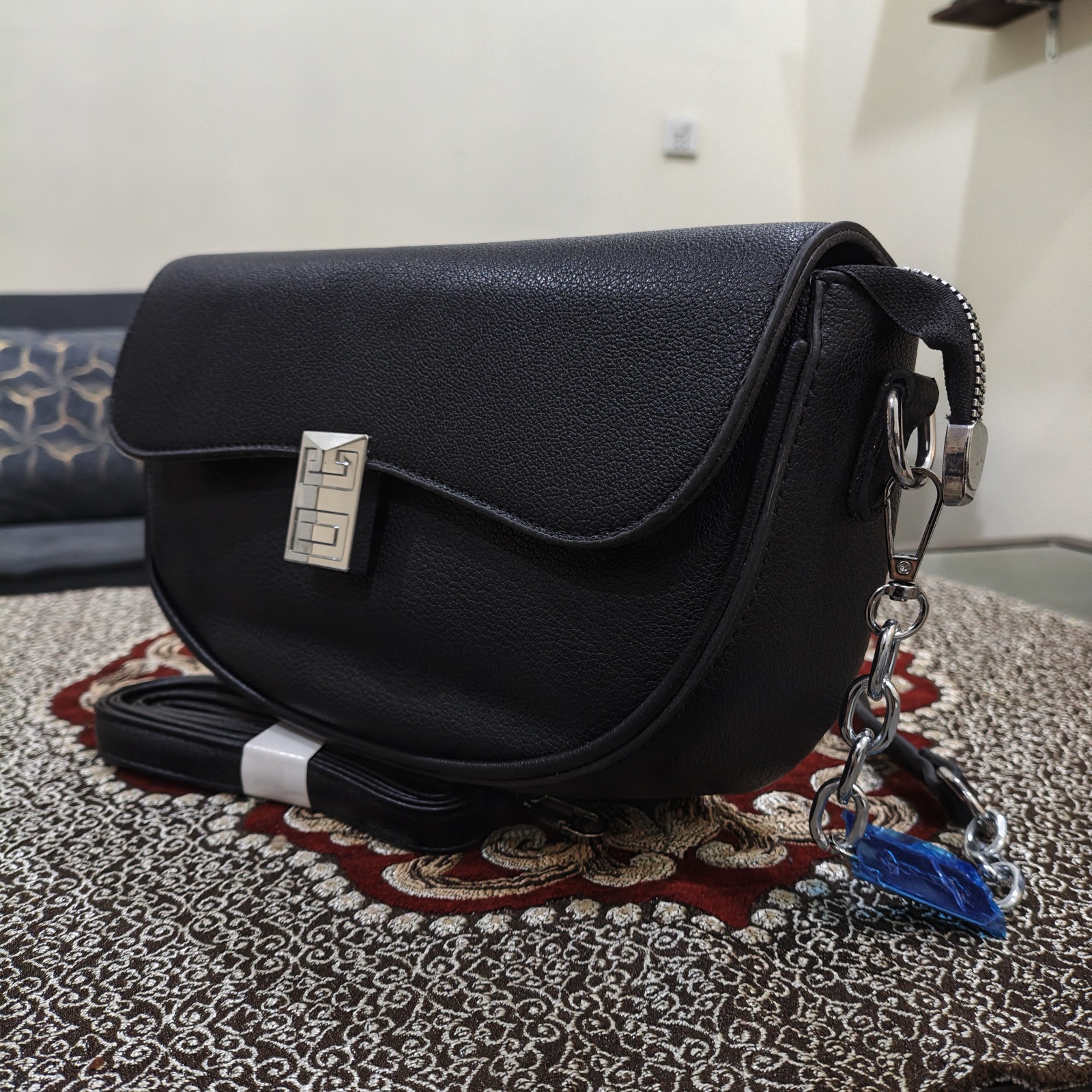 Women's Black Saddle Crossbody Bag with Silver Turn-Lock & Zip Pockets